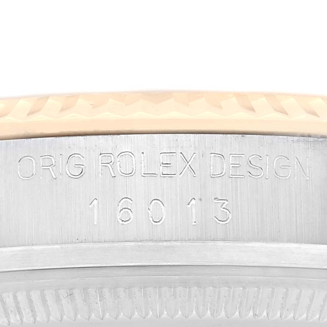 The image shows the engraved bezel of a Rolex Vintage Collection 16013 Men's Steel and Gold (two tone) Champagne Dial 16013 Men's Steel and Gold (two tone) Champagne Dial model 16013, highlighting the "Orig Rolex Design" inscription.