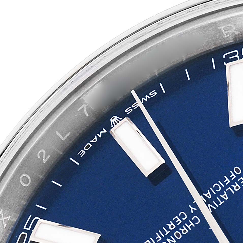 This close-up image of the Rolex Datejust 41 126300 Men's Stainless Steel Blue Dial 126300 Men's Stainless Steel Blue Dial shows the watch's blue dial, hour markers, and part of the bezel.