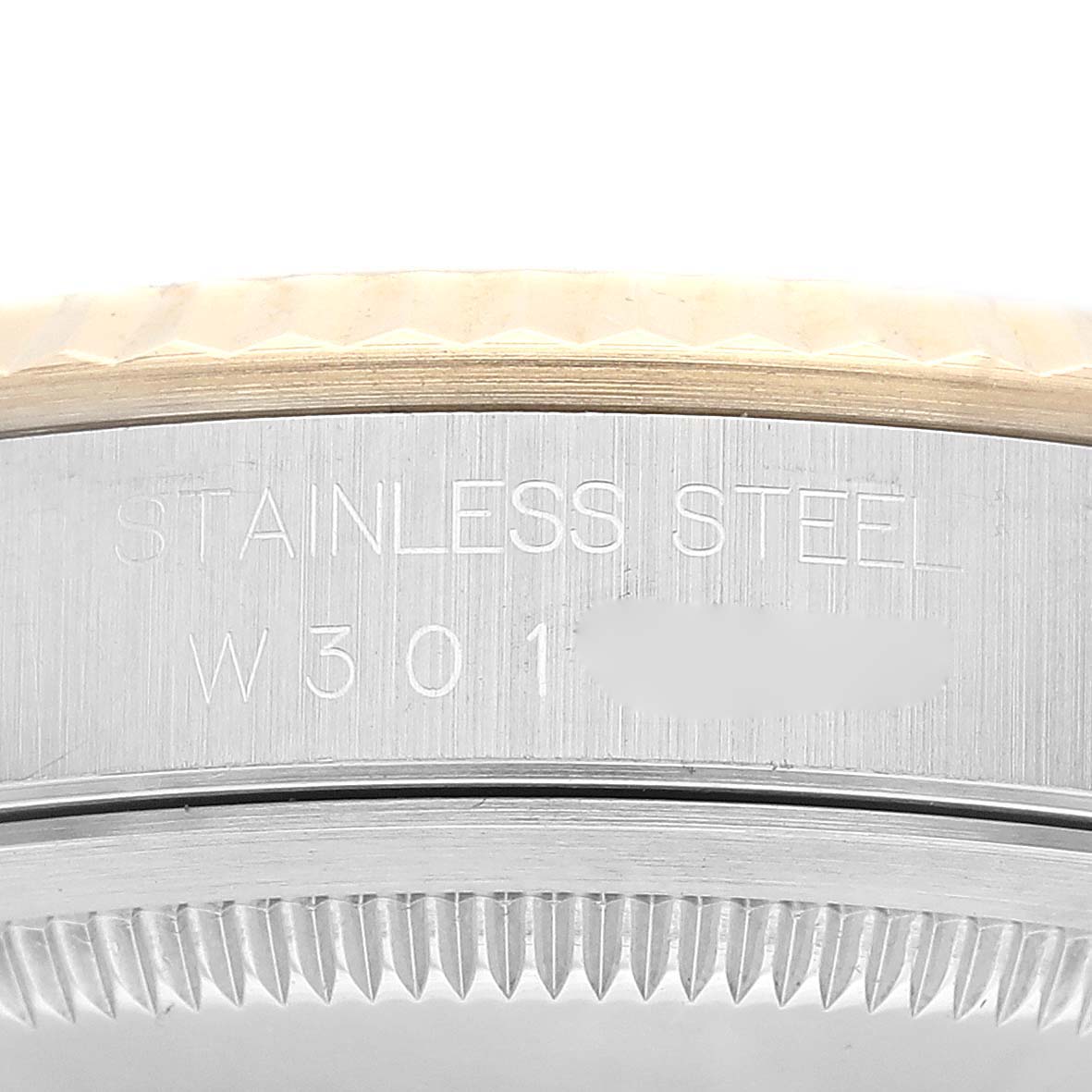 The image shows a close-up of the stainless steel case back and fluted bezel of a Rolex Datejust 16233 Men's Steel and Gold (two tone) Champagne Dial 16233 Men's Steel and Gold (two tone) Champagne Dial watch.