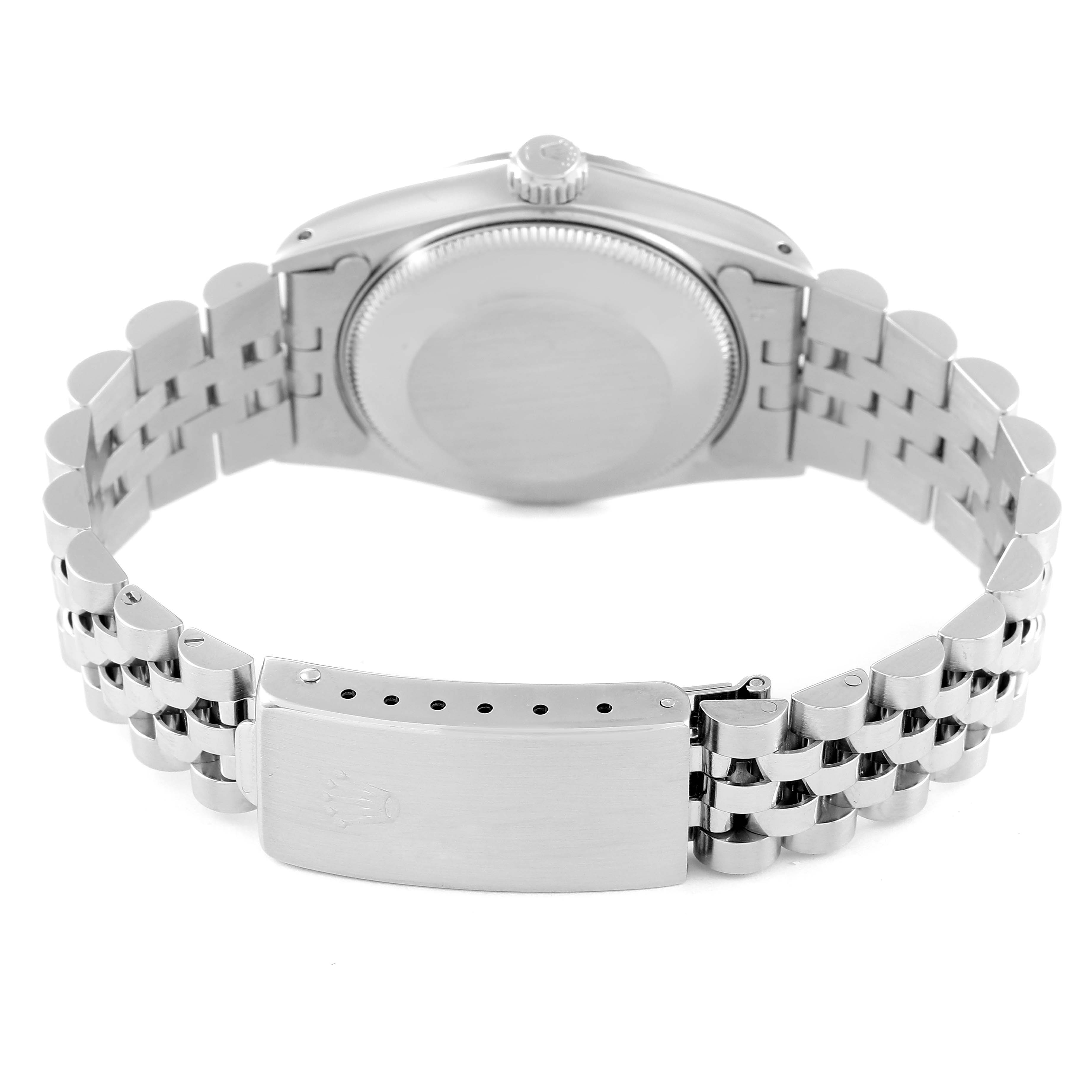 This image shows the back view of a Mid-Size Rolex watch, featuring its stainless steel case, closed case back, and bracelet with a deployment clasp.