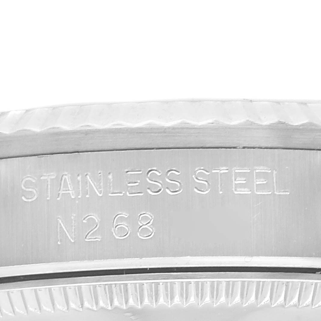 The image shows a close-up of the side engraving on a stainless steel Rolex Mid-Size 68274 Women
s Stainless Steel Silver Dial 68274 Women
s Stainless Steel Silver Dial model watch.