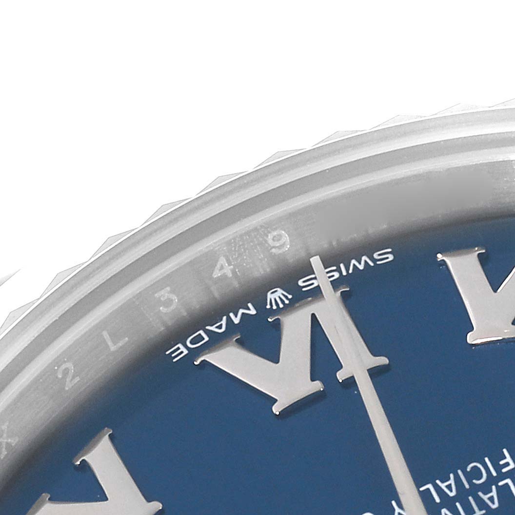 This close-up shows part of the dial and bezel of a Mid-Size Rolex watch with visible Roman numerals and the "Swiss Made" text.