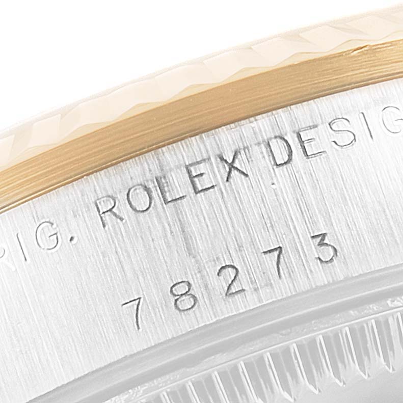 The image shows a close-up of the case side of a Mid-Size Rolex watch, displaying the model number and design engraving.