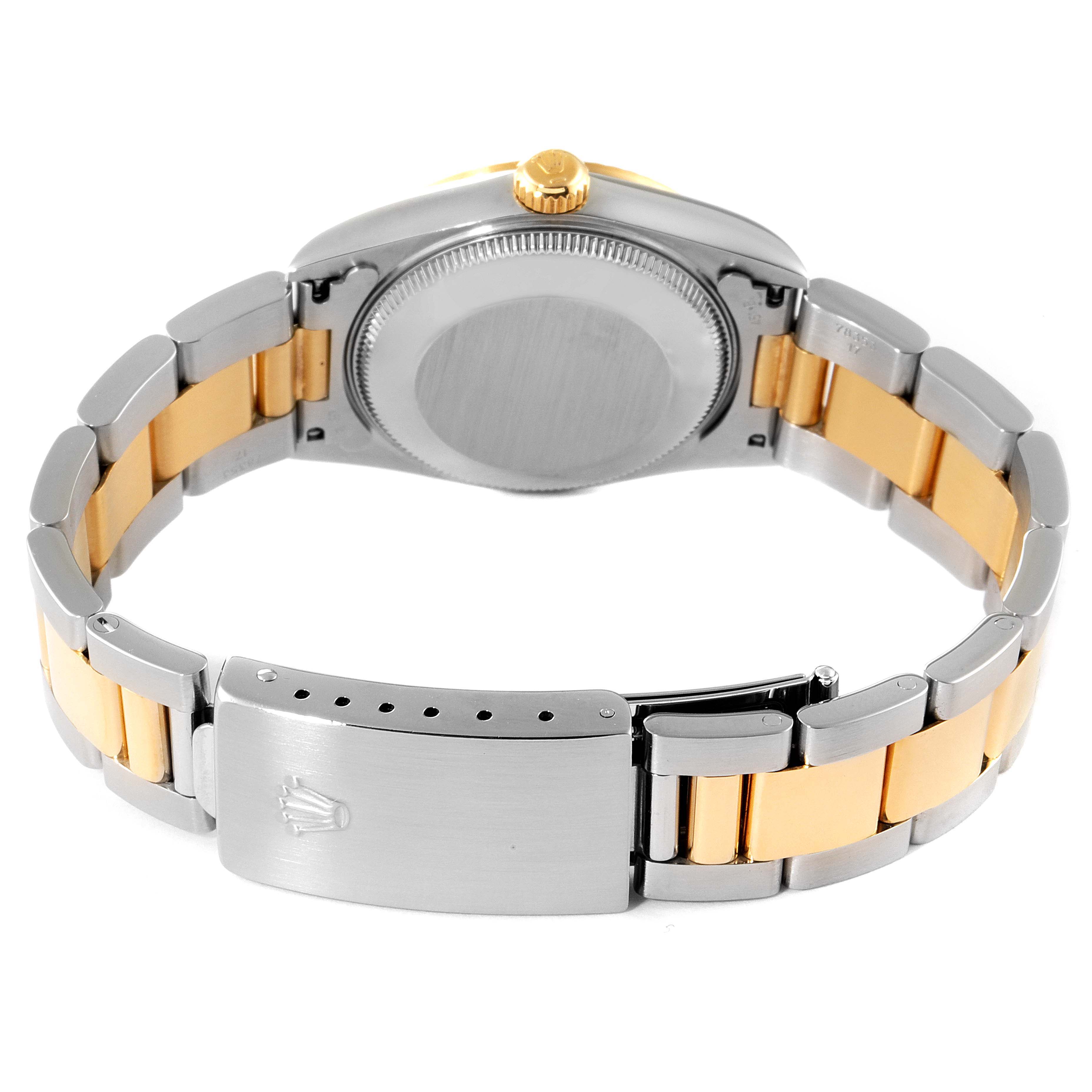 The image shows the rear view of a mid-size Rolex watch, highlighting the two-tone bracelet and clasp.