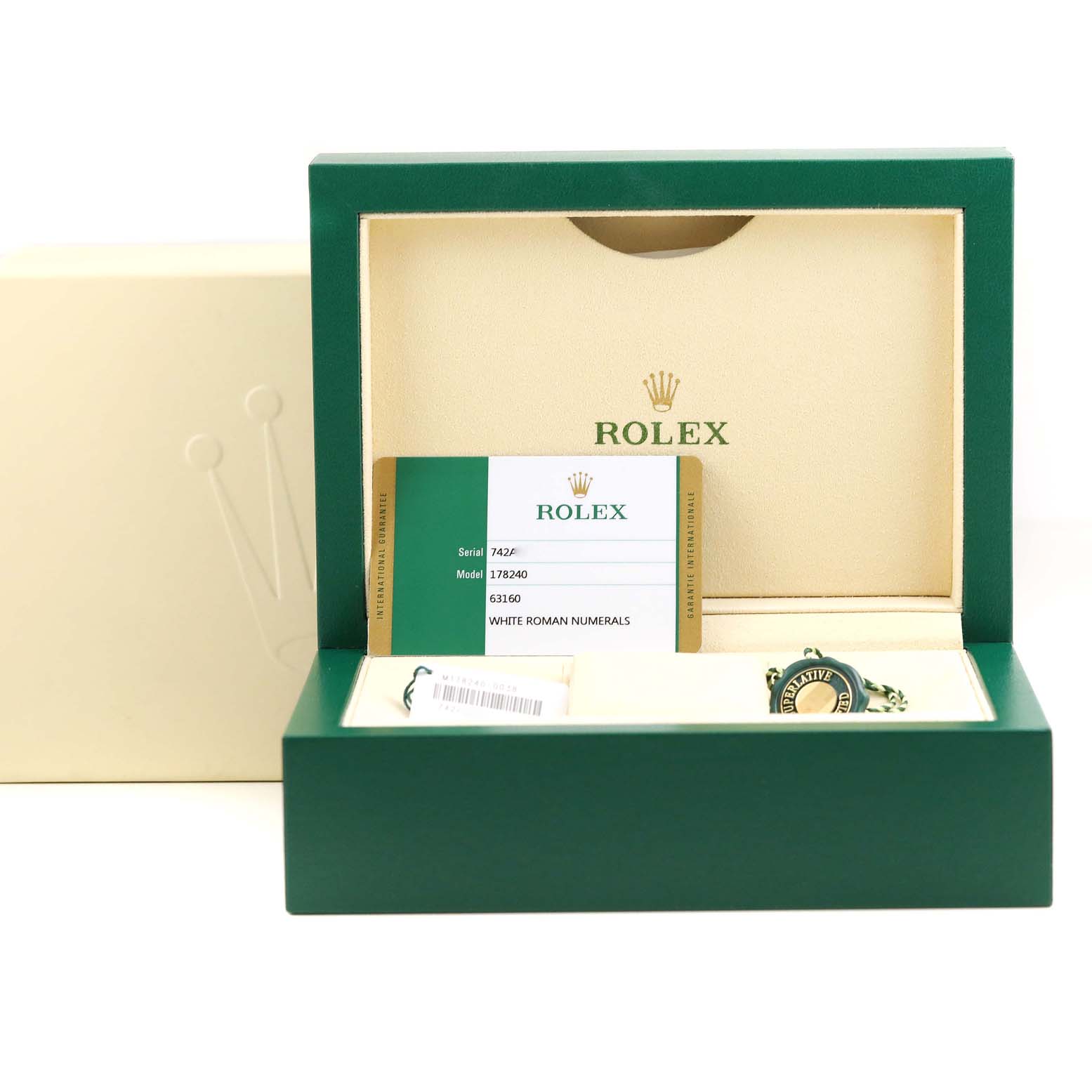 This image shows the open box of a Rolex Mid-Size 178240 Women's Stainless Steel White Dial 178240 Women's Stainless Steel White Dial model with tags and an authenticity card.