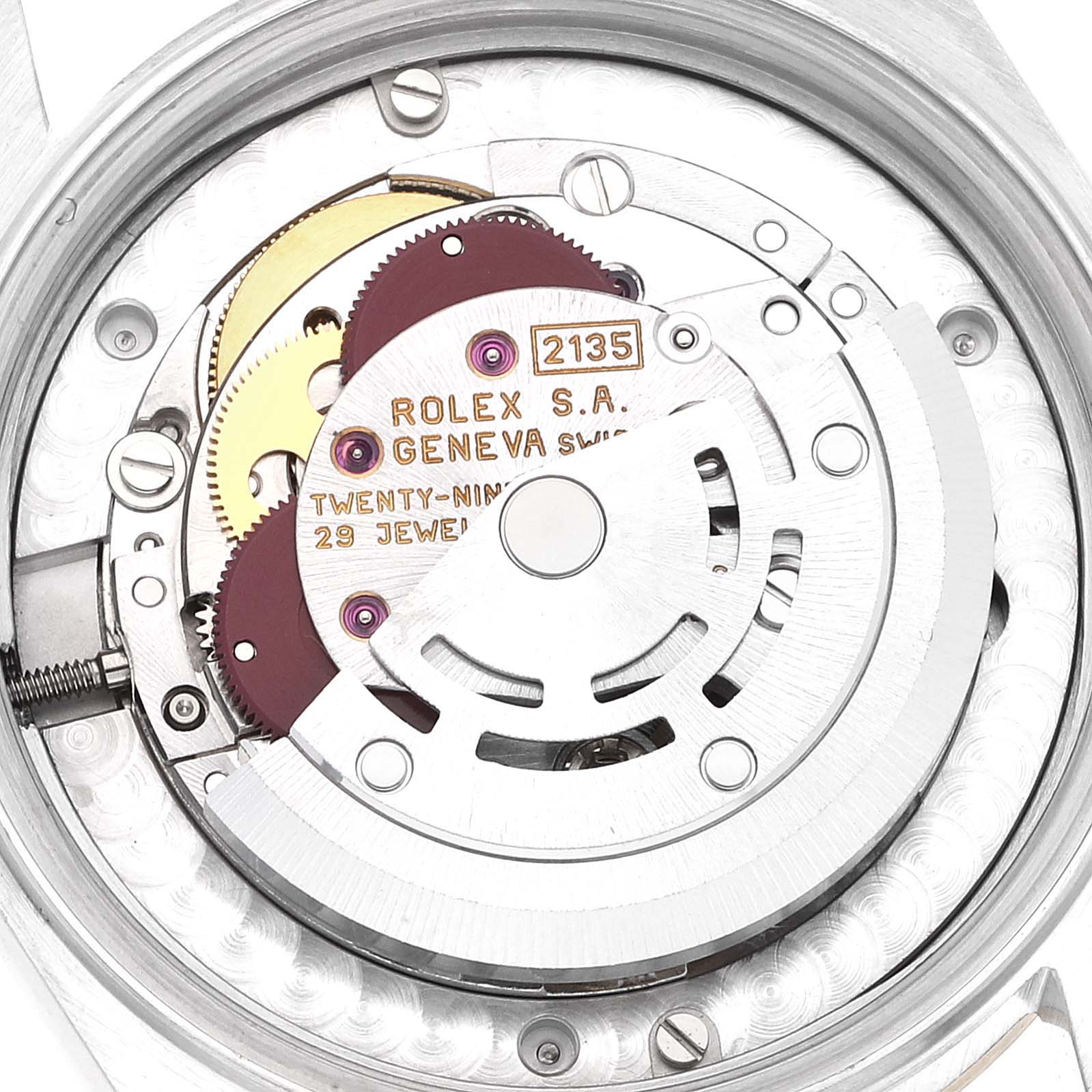 This image shows a close-up view of the movement of a Rolex Mid-Size 68273 Women
s Steel and Gold (two tone) Champagne Dial 68273 Women
s Steel and Gold (two tone) Champagne Dial model, highlighting the gears and the inscribed rotor.