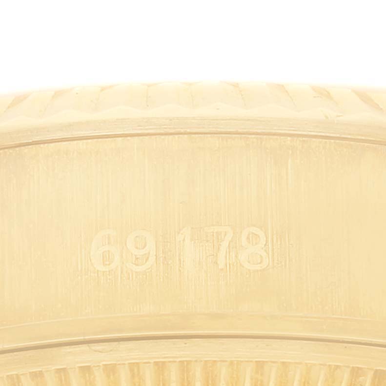 This close-up image shows the side engraving of the Rolex President 69178 Women
s Yellow Gold Champagne Dial 69178 Women
s Yellow Gold Champagne Dial model, focusing on the reference number "69178."