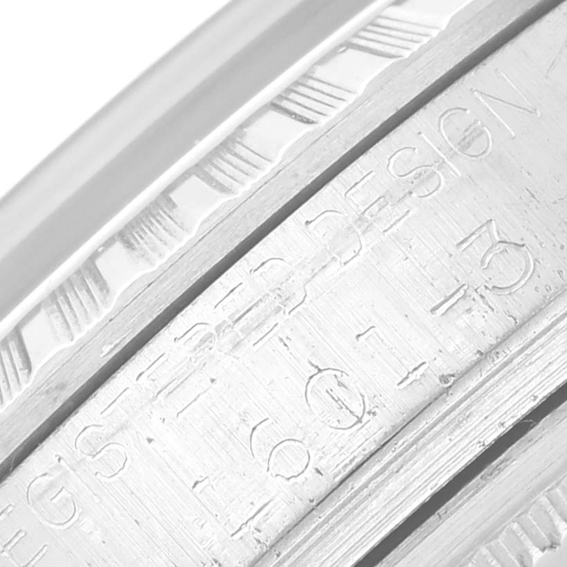 This close-up image showcases the engraved details on the case of a Rolex Vintage Collection 1601 Men's Stainless Steel Silver Dial 1601 Men's Stainless Steel Silver Dial watch.