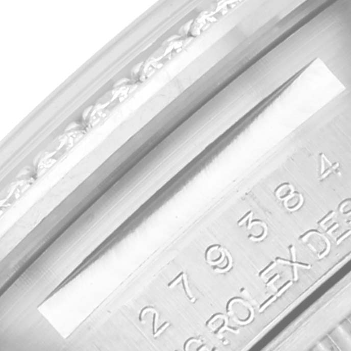 This image shows a close-up of the serial number engraving on a Rolex Datejust 279384 Women's Stainless Steel Mother of Pearl Dial 279384 Women's Stainless Steel Mother of Pearl Dial bezel.