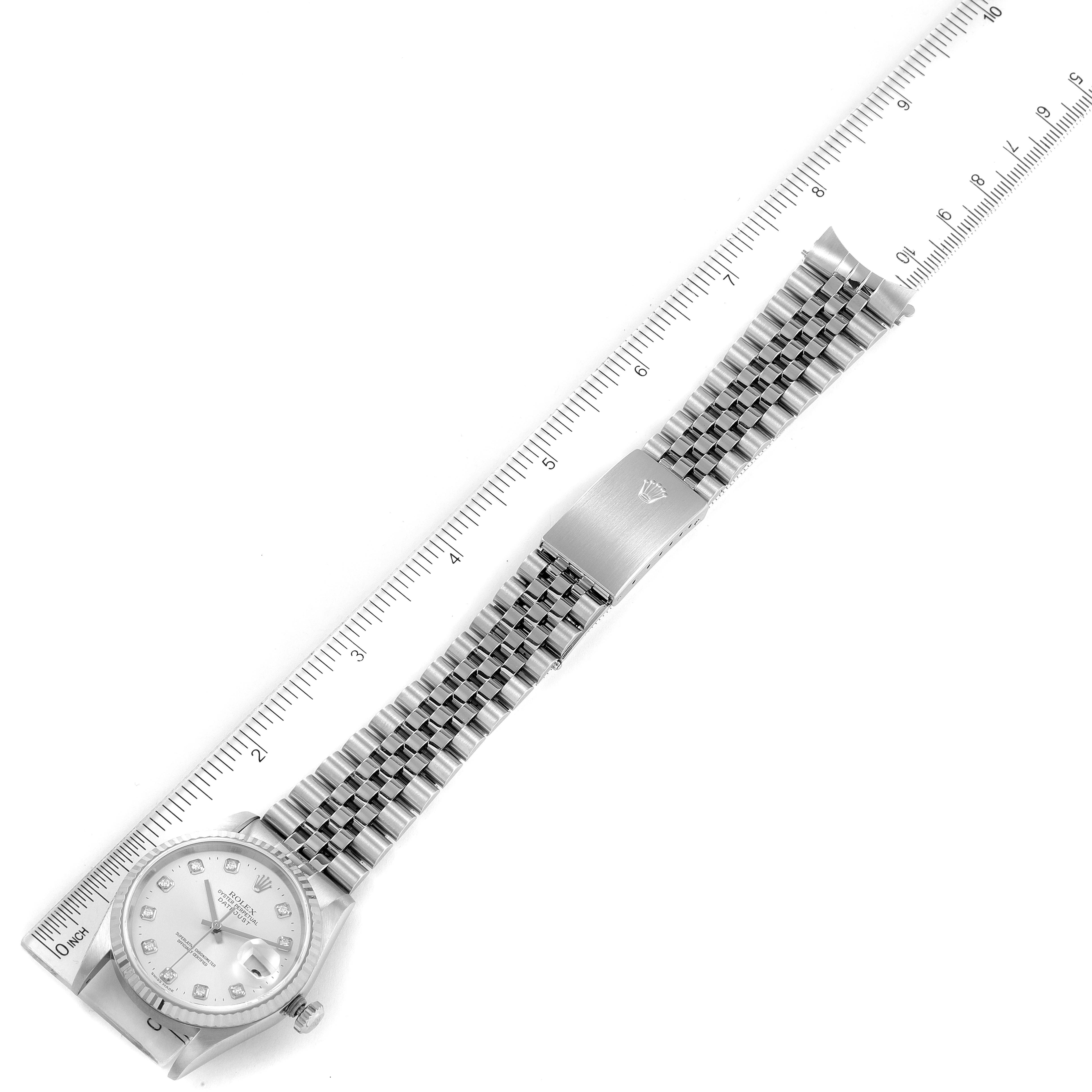 The image displays the entire Rolex Datejust 16234 Men's Stainless Steel Silver Dial 16234 Men's Stainless Steel Silver Dial watch, including the face, bezel, bracelet, and clasp, alongside a ruler for measurement.