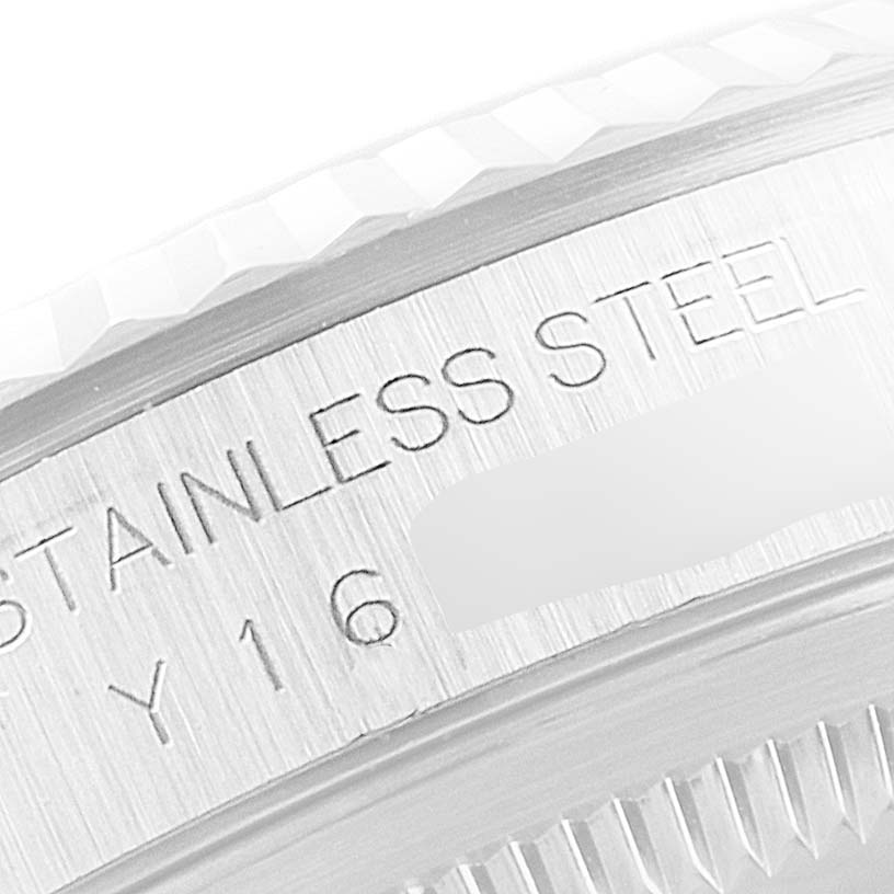 This image shows a close-up of the stainless steel engraving and part of the bezel on a Rolex Datejust 16234 Men's Stainless Steel Silver Dial 16234 Men's Stainless Steel Silver Dial watch.