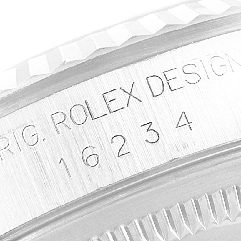 This image shows a close-up of the model and serial number engraving on the side of the Rolex Datejust 16234 Men's Stainless Steel Silver Dial 16234 Men's Stainless Steel Silver Dial watch case.