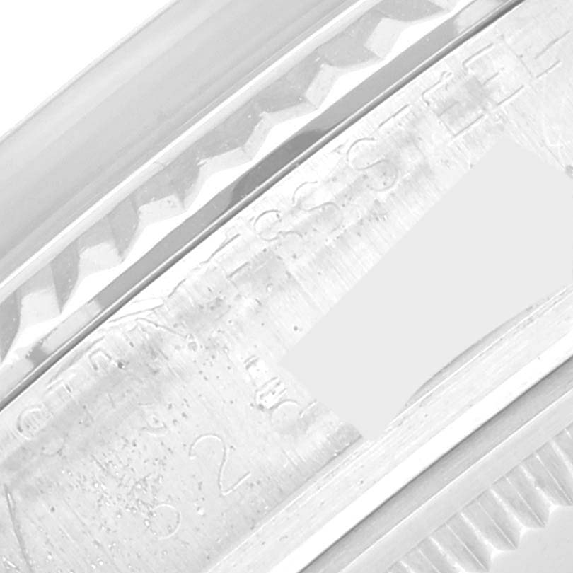 This close-up image shows the bezel and engraving on the side of a Rolex Vintage Collection 16014 Men's Stainless Steel Silver Dial 16014 Men's Stainless Steel Silver Dial model watch.