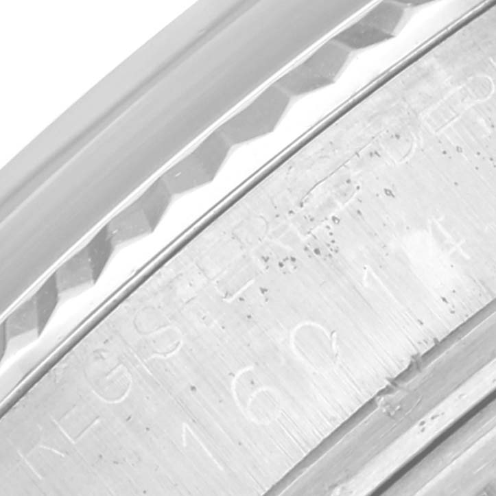 This close-up image shows the engraved serial number and part of the case for the Rolex Vintage Collection 16014 Men's Stainless Steel Silver Dial 16014 Men's Stainless Steel Silver Dial model.
