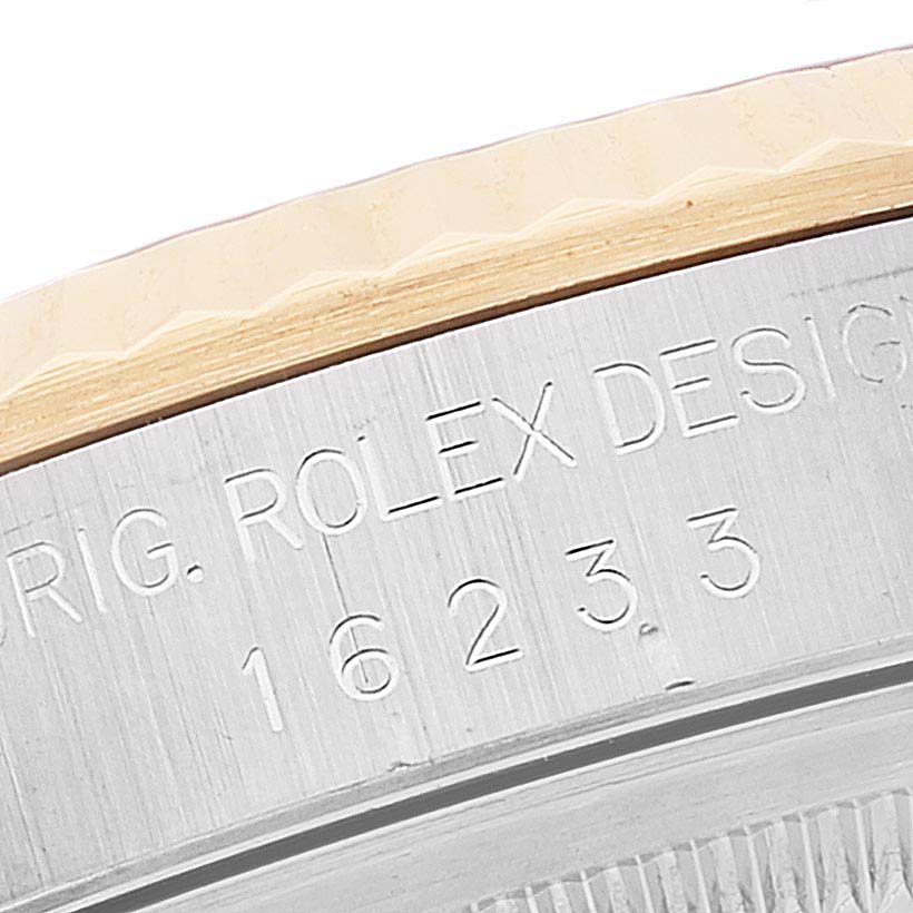 This image shows a macro view of the engraved case back of a Rolex Datejust 16233 Men's Steel and Gold (two tone) Black Dial 16233 Men's Steel and Gold (two tone) Black Dial watch.