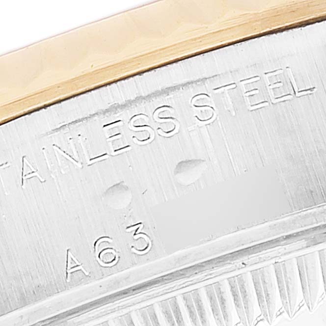 This image shows a close-up of the watch case rim and part of the bezel on a Rolex Datejust 79173 Women's Steel and Gold (two tone) Black Dial 79173 Women's Steel and Gold (two tone) Black Dial model.