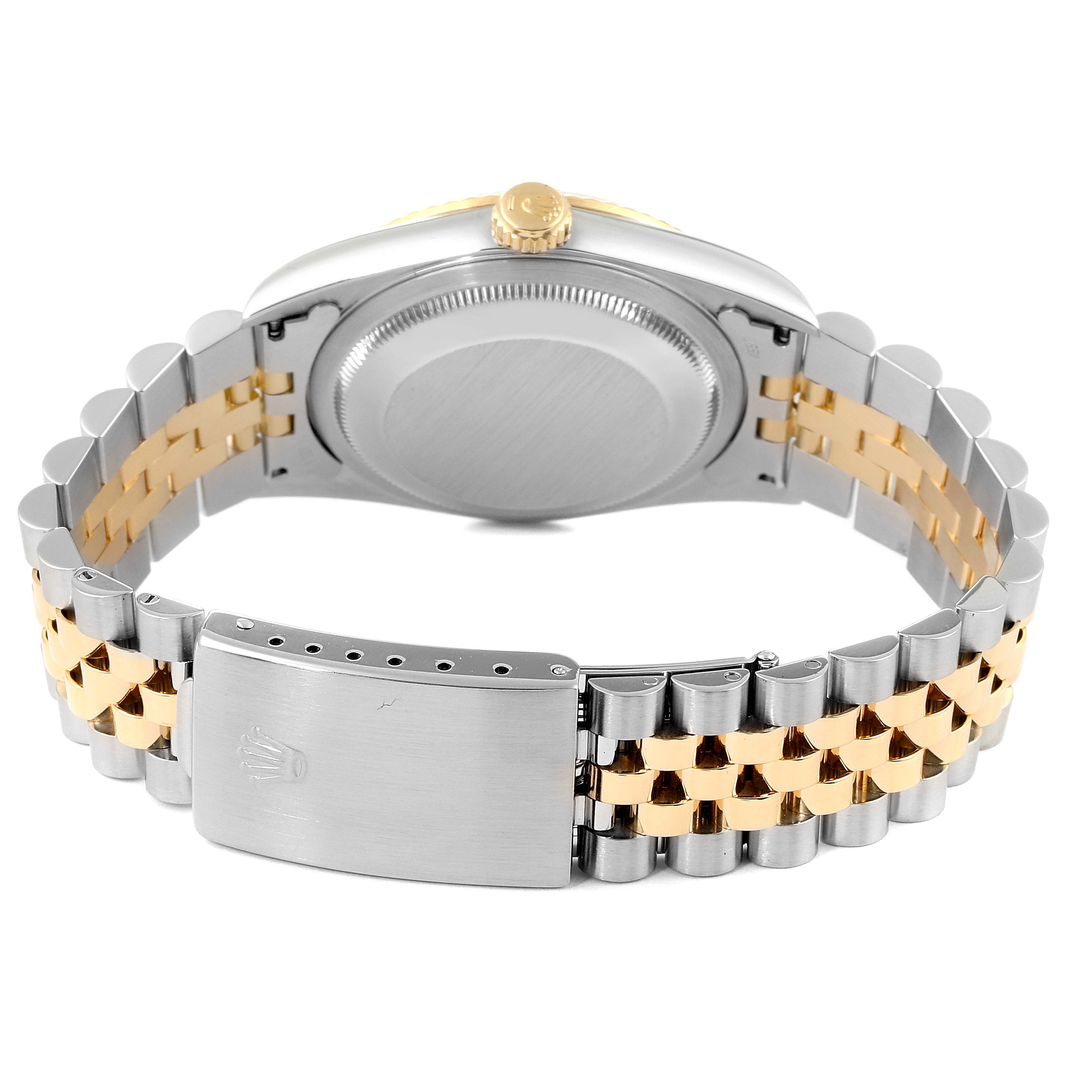This image shows the back of a Rolex Datejust 16233 Men
s Steel and Gold (two tone) Black Dial 16233 Men
s Steel and Gold (two tone) Black Dial watch, highlighting the two-tone bracelet and the clasp.