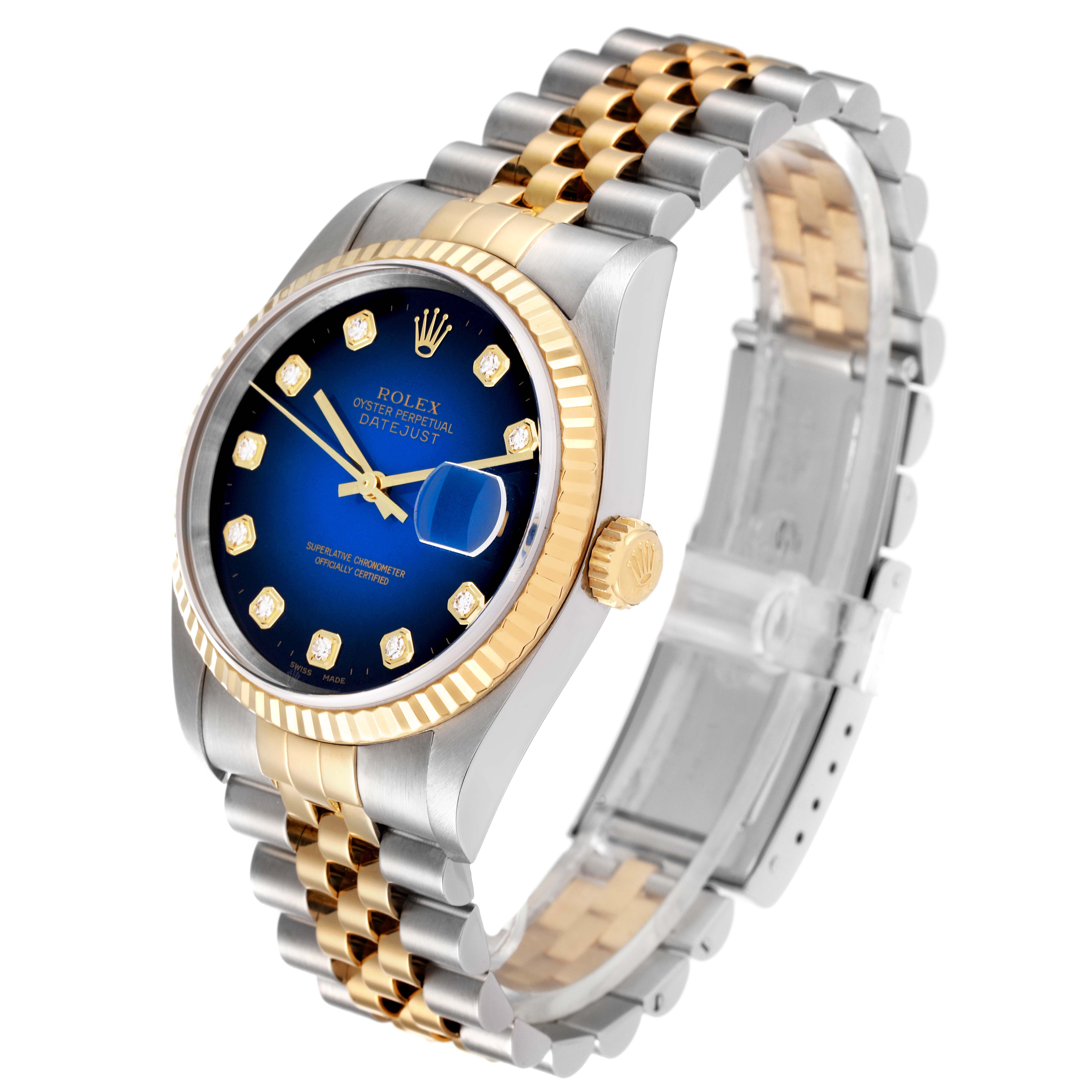 The image shows a Rolex Datejust 16233 Men's Steel and Gold (two tone) Blue Dial 16233 Men's Steel and Gold (two tone) Blue Dial watch from a three-quarter angle, highlighting its blue dial, gold fluted bezel, and two-tone bracelet.