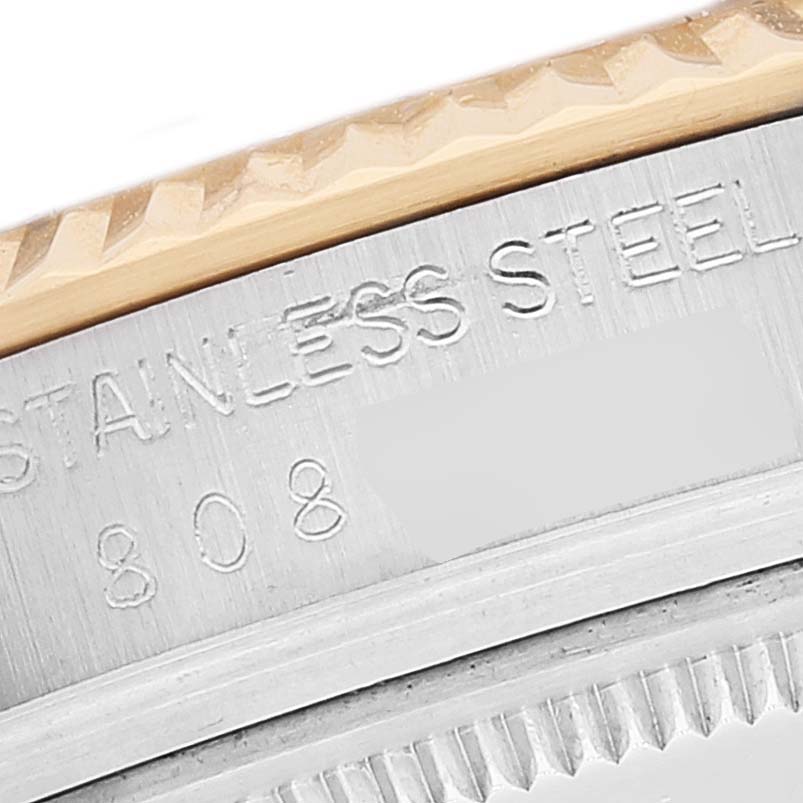 This close-up image shows the side of the case and bezel of a Rolex Vintage Collection 16013 Men's Steel and Gold (two tone) White Dial 16013 Men's Steel and Gold (two tone) White Dial watch, highlighting the 'STAINLESS STEEL' engraving.