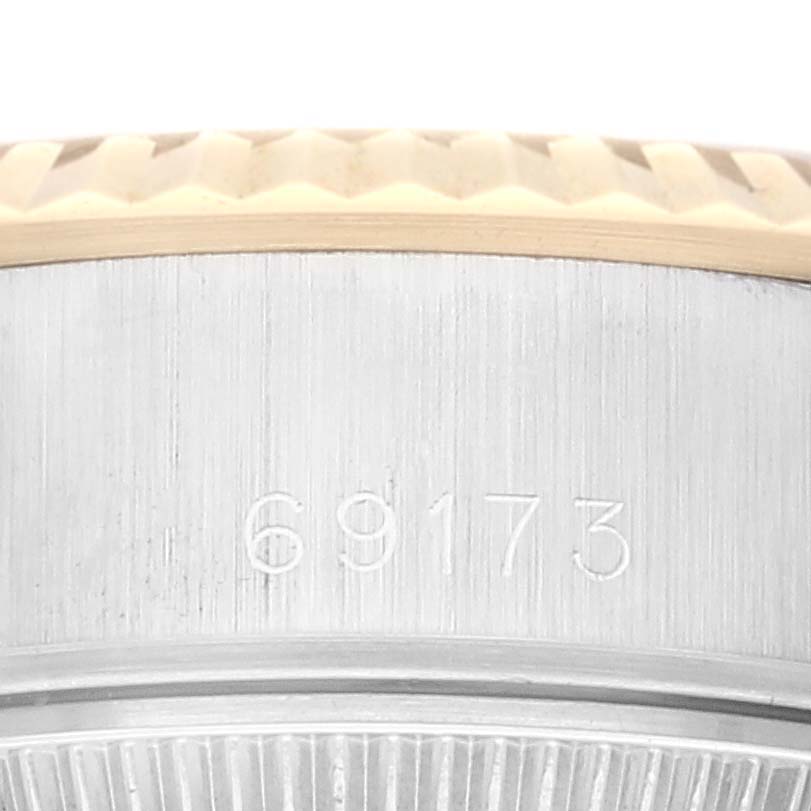 This image shows a close-up of the side of a Rolex Datejust 69173G Women's Steel and Gold (two tone) Champagne Dial 69173G Women's Steel and Gold (two tone) Champagne Dial model, revealing the model number "69173."