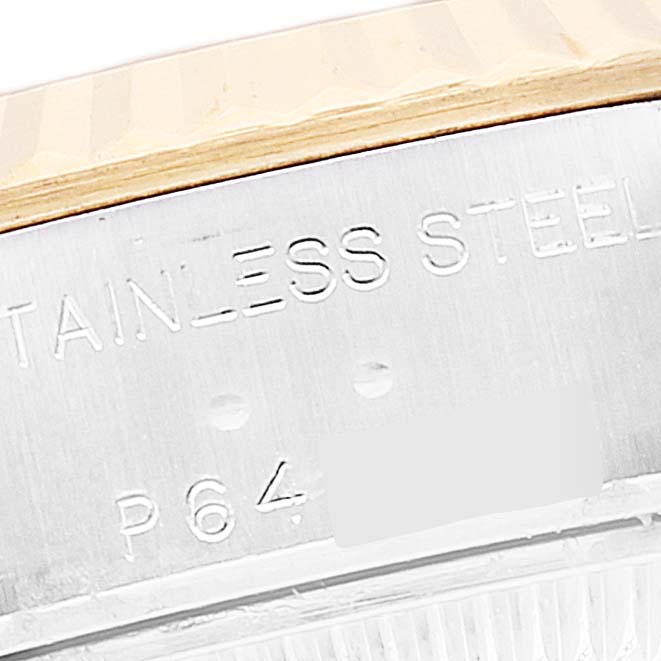 Close-up of the Rolex Datejust 79173 Women's Steel and Gold (two tone) Beige Dial 79173 Women's Steel and Gold (two tone) Beige Dial model showing part of its stainless steel bezel with engraved text.