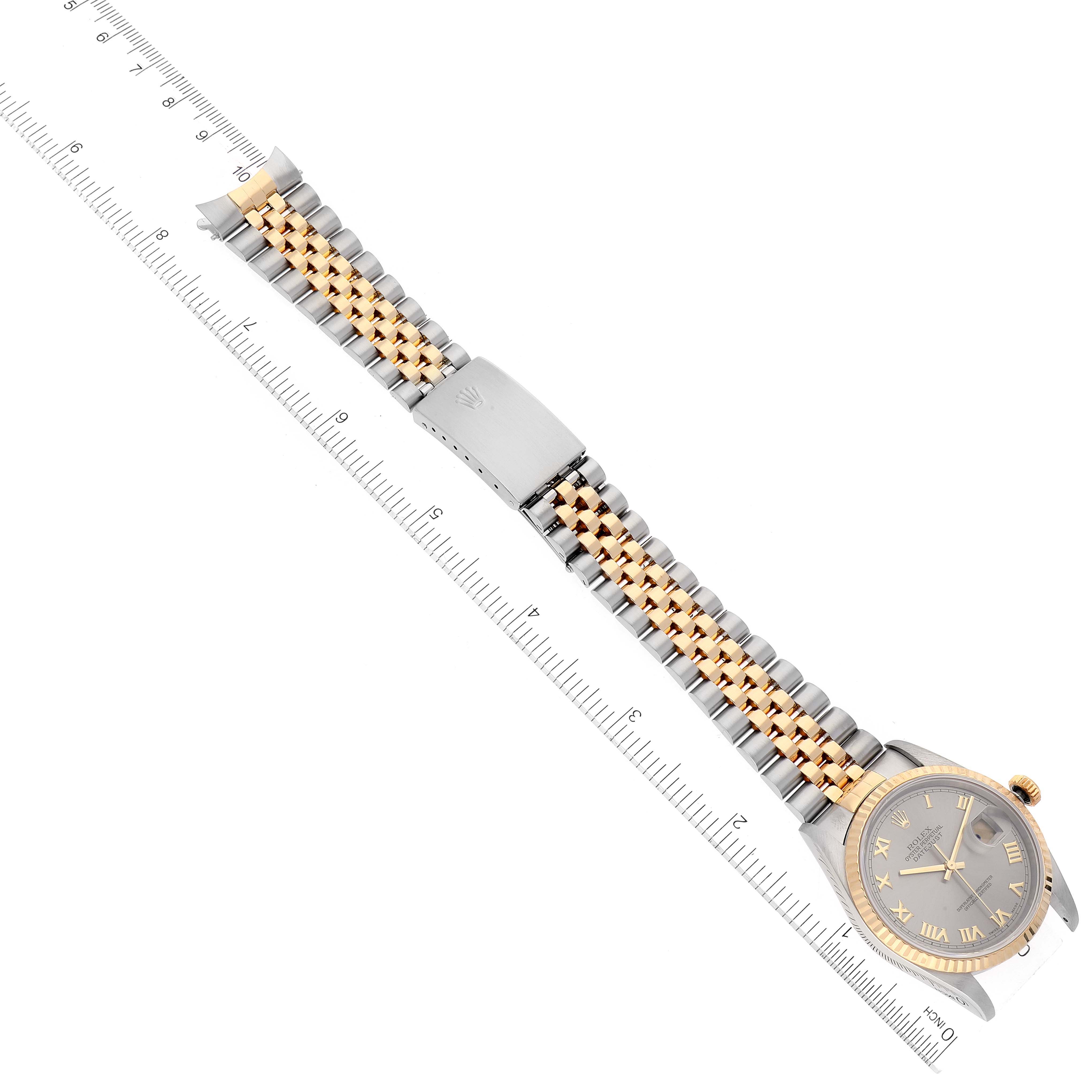 The image shows a top-down view of a Rolex Datejust 16233 Men's Steel and Gold (two tone) Grey Dial 16233 Men's Steel and Gold (two tone) Grey Dial watch highlighting its face, bracelet, and clasp.