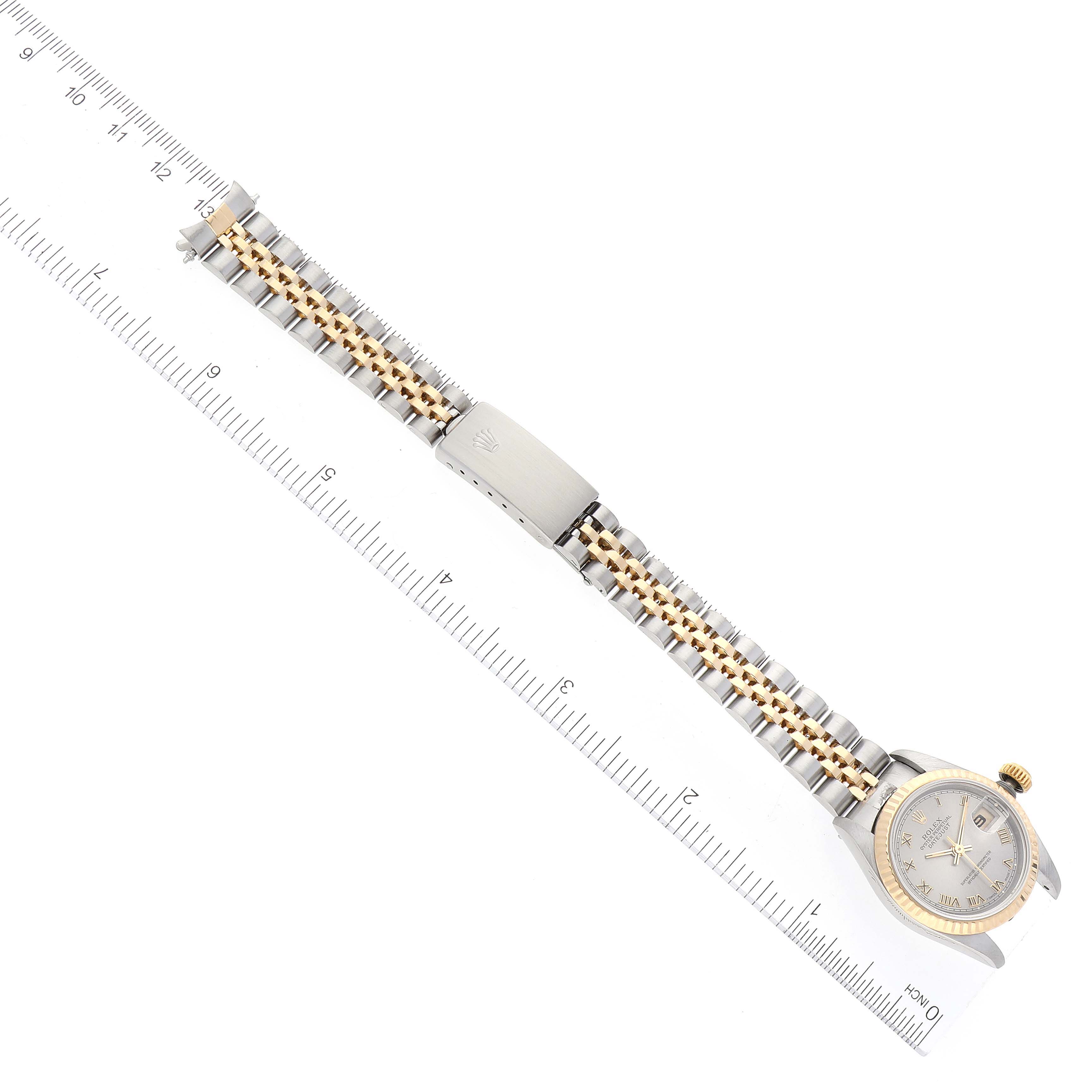The image shows a Rolex Datejust 69173 Women's Steel and Gold (two tone) Grey Dial 69173 Women's Steel and Gold (two tone) Grey Dial watch laid out flat with the bracelet and clasp fully extended along with a ruler for scale.