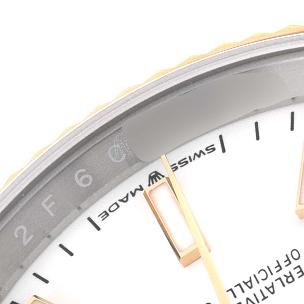 This image shows a close-up of the dial and edge of a Rolex Datejust 126233 Men's Steel and Gold (two tone) White Dial 126233 Men's Steel and Gold (two tone) White Dial watch, highlighting the indices and the "Swiss Made" text.
