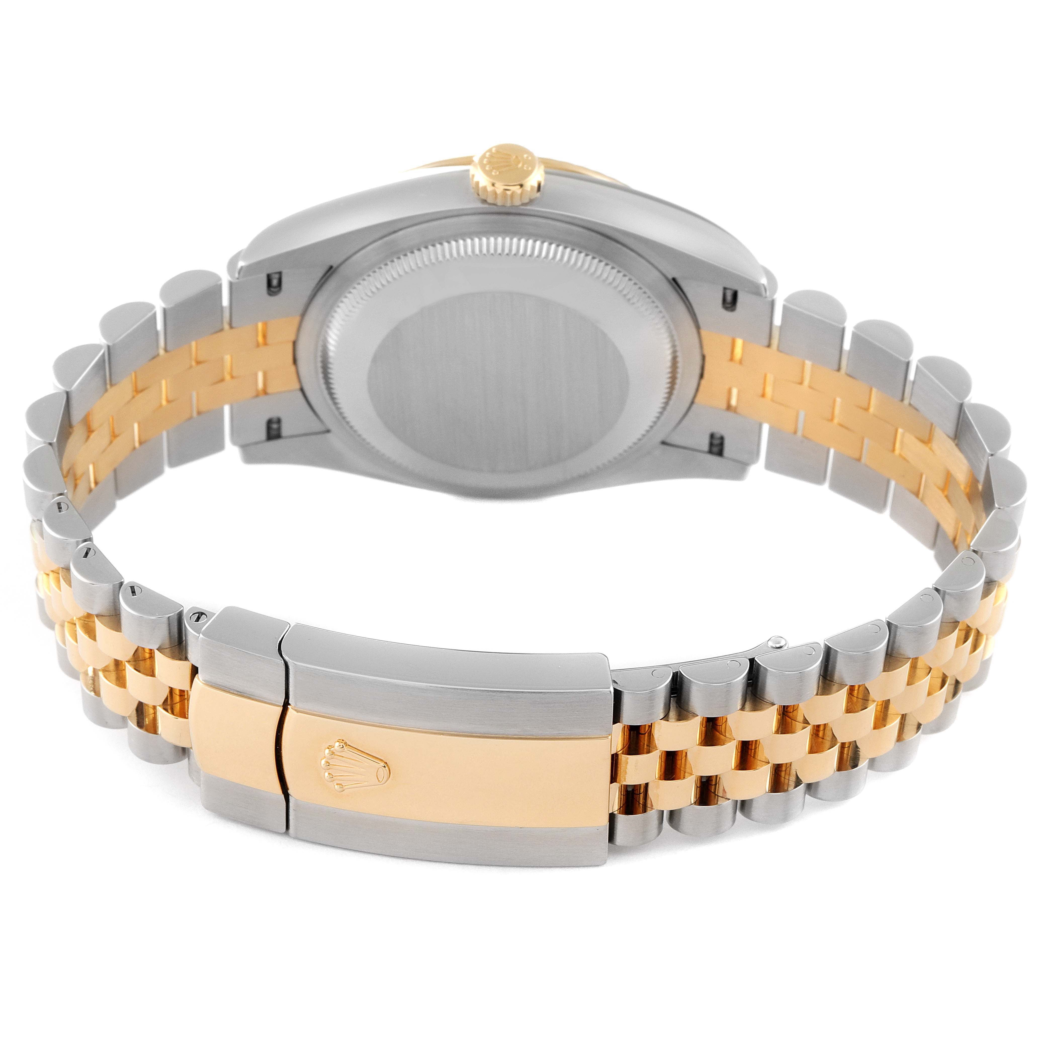 This image shows the back case and clasp of a Rolex Datejust 126233 Men's Steel and Gold (two tone) White Dial 126233 Men's Steel and Gold (two tone) White Dial watch with a two-tone bracelet.