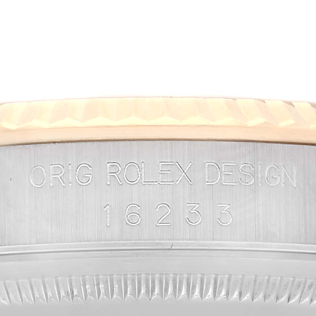 This image shows an angled close-up of the side of the case of a Rolex Datejust 16233 Men's Steel and Gold (two tone) White Dial 16233 Men's Steel and Gold (two tone) White Dial model, featuring the model number and design engraving.