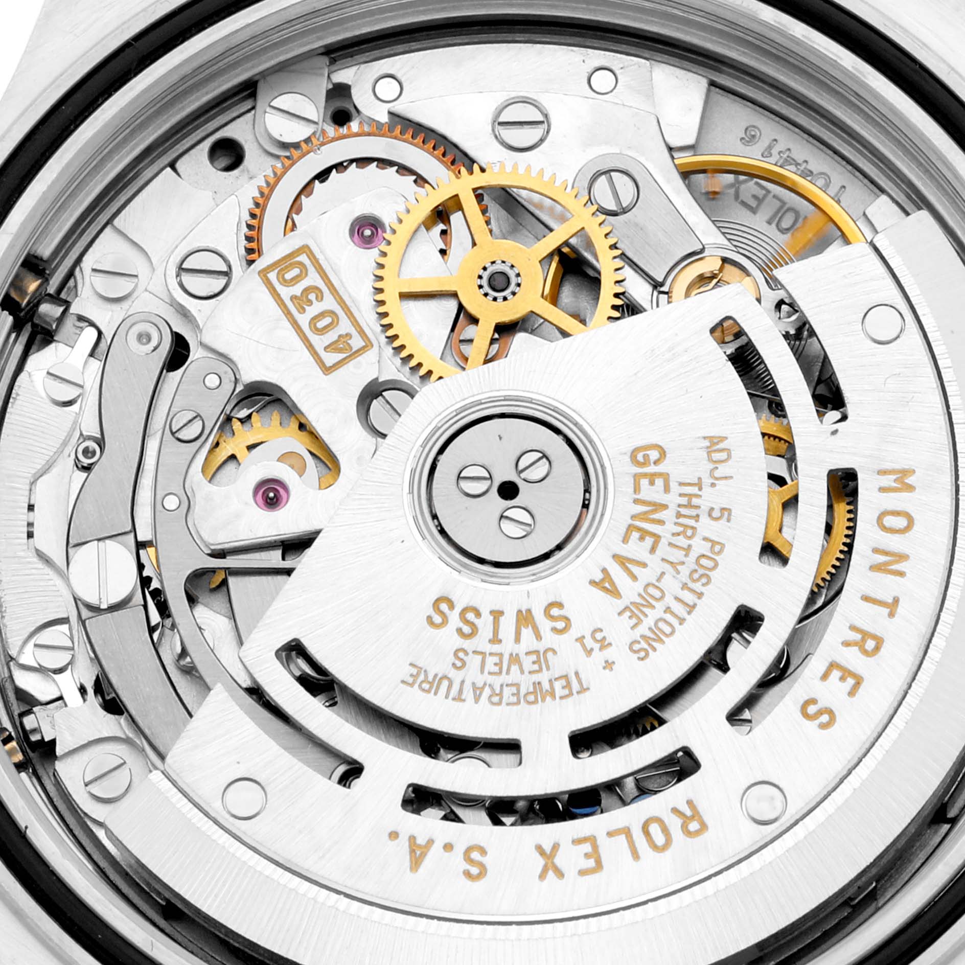 This image shows the intricate internal movement parts of a Rolex Daytona 16523 Men's Steel and Gold (two tone) Black Dial 16523 Men's Steel and Gold (two tone) Black Dial watch from a close-up angle.