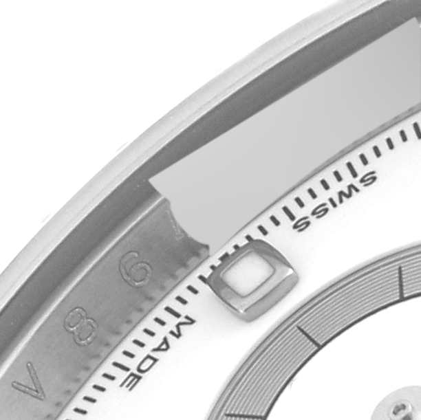 This image shows a close-up of the dial and bezel of a Rolex Daytona 116520 Men's Stainless Steel White Dial 116520 Men's Stainless Steel White Dial watch, highlighting part of the number 8 and the word "SWISS."