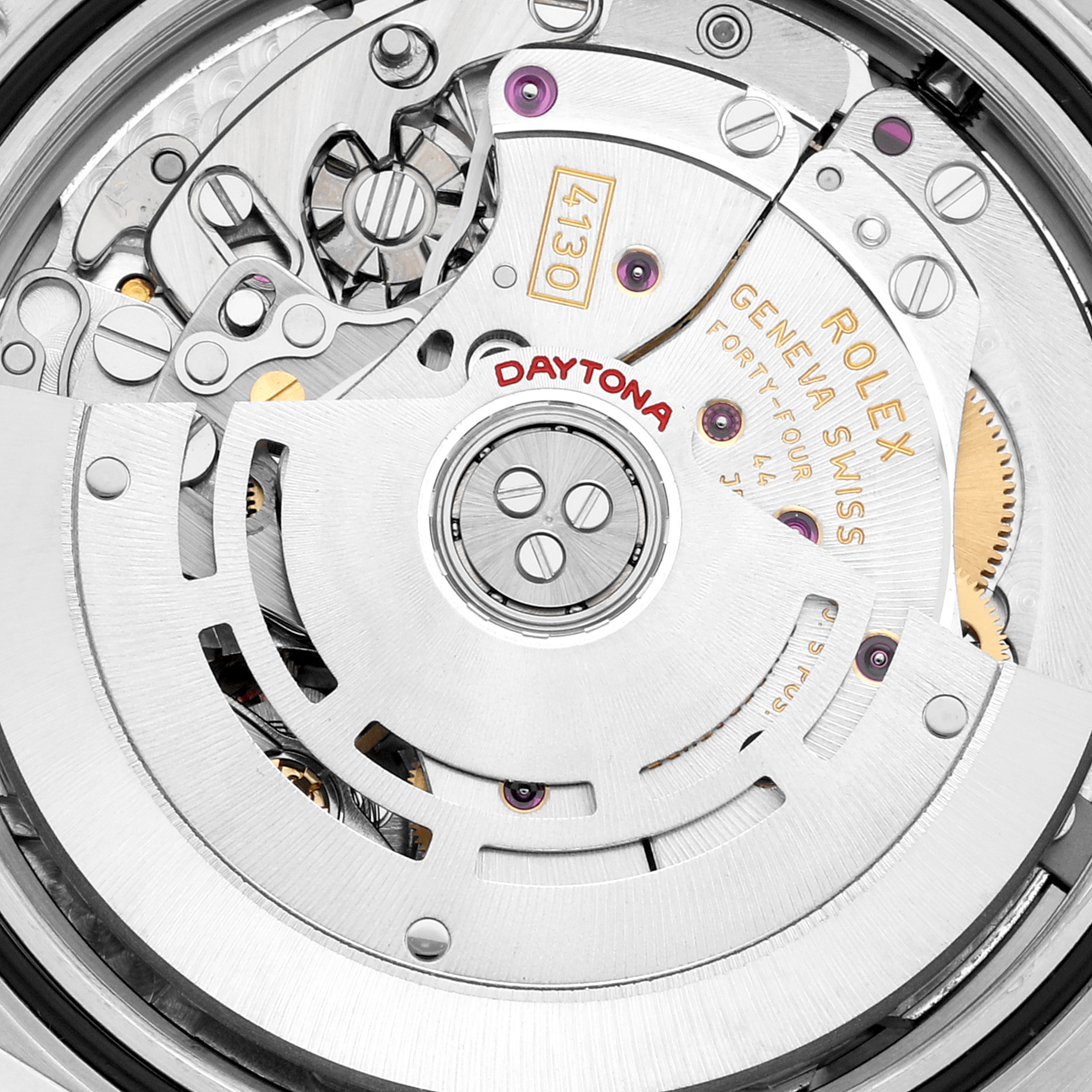The image shows a close-up of the movement components of a Rolex Daytona 116520 Men's Stainless Steel White Dial 116520 Men's Stainless Steel White Dial watch, featuring the oscillating rotor and caliber markings.