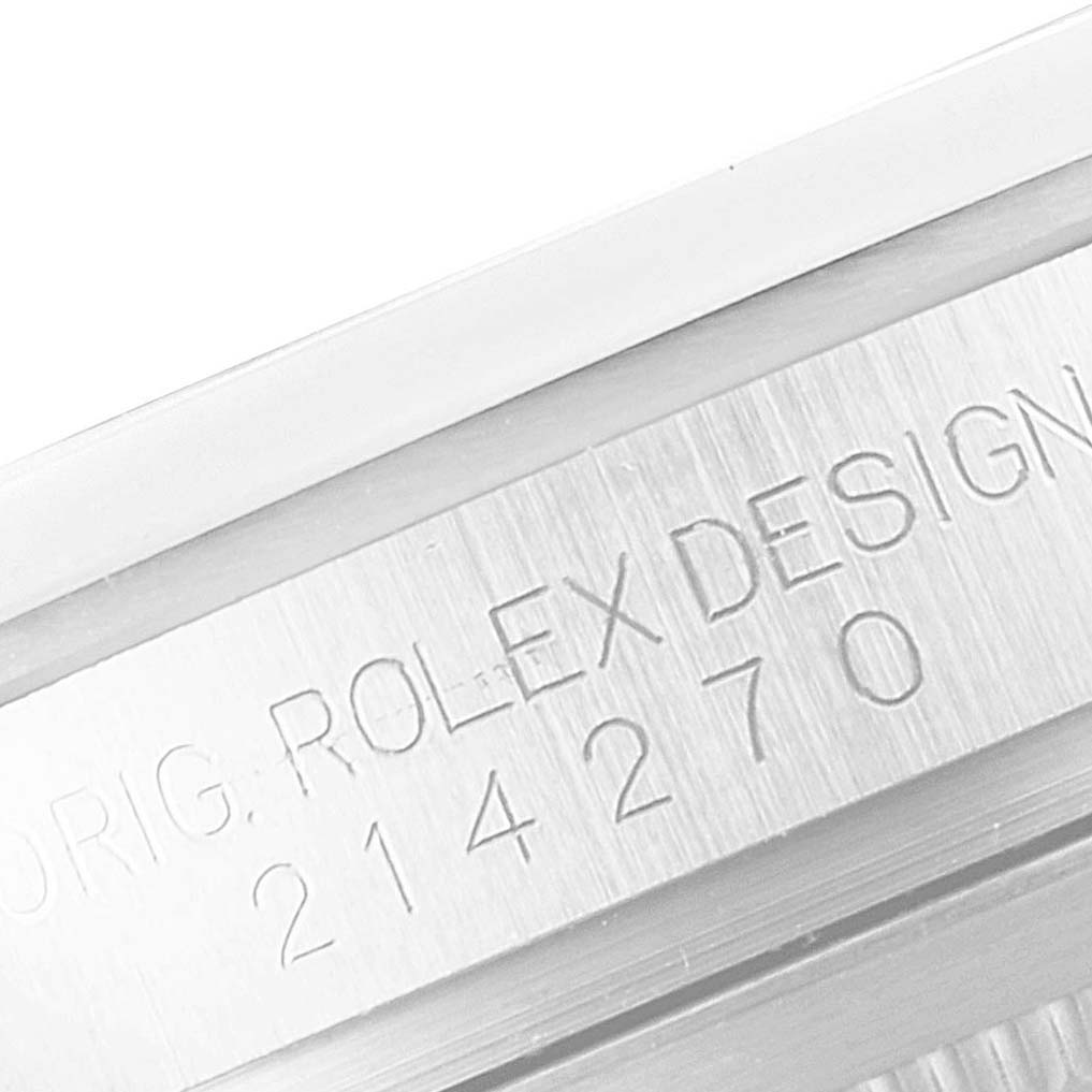 This close-up image shows the engraved serial and model numbers on the side of a Rolex Explorer 214270 Men
s Stainless Steel Black Dial 214270 Men
s Stainless Steel Black Dial watch case.