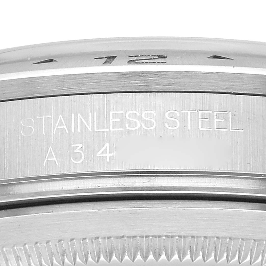 Close-up of the side engraving and part of the bezel of the Rolex Explorer 16570 Men
s Stainless Steel White Dial 16570 Men
s Stainless Steel White Dial watch in stainless steel.