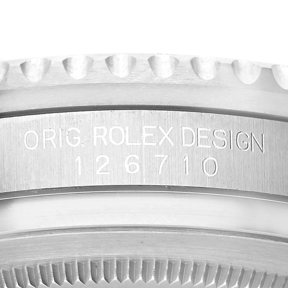 This close-up image shows the engraved serial number and bezel of the Rolex GMT-Master 126710 Men's Stainless Steel Black Dial 126710 Men's Stainless Steel Black Dial model.