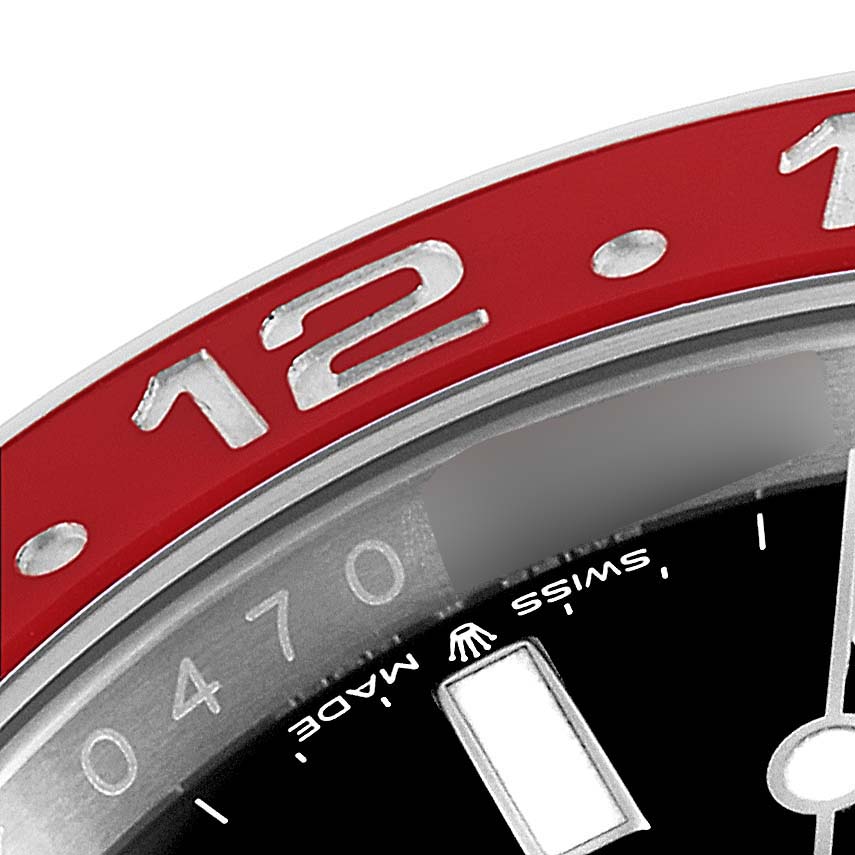 This close-up image shows the bezel and part of the dial of a Rolex GMT-Master 126710 Men
s Stainless Steel Black Dial 126710 Men
s Stainless Steel Black Dial watch.