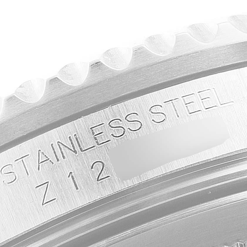 This image shows a close-up of the bezel and side engraving on a stainless steel Rolex GMT-Master 16710 Men
s Stainless Steel Black Dial 16710 Men
s Stainless Steel Black Dial watch.