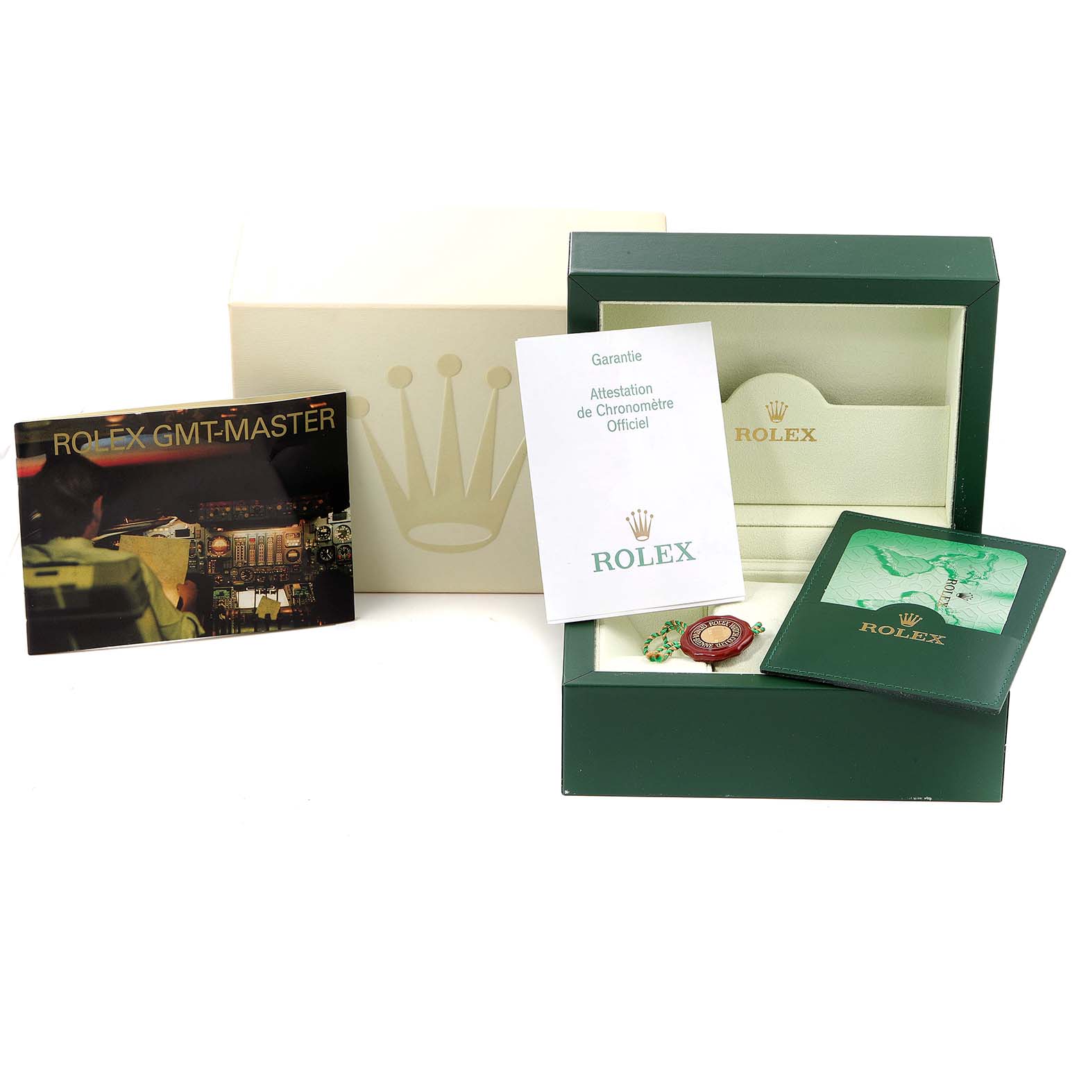 The image shows the packaging, warranty card, manuals, and accessories for a Rolex GMT-Master 16710 Men
s Stainless Steel Black Dial 16710 Men
s Stainless Steel Black Dial watch.