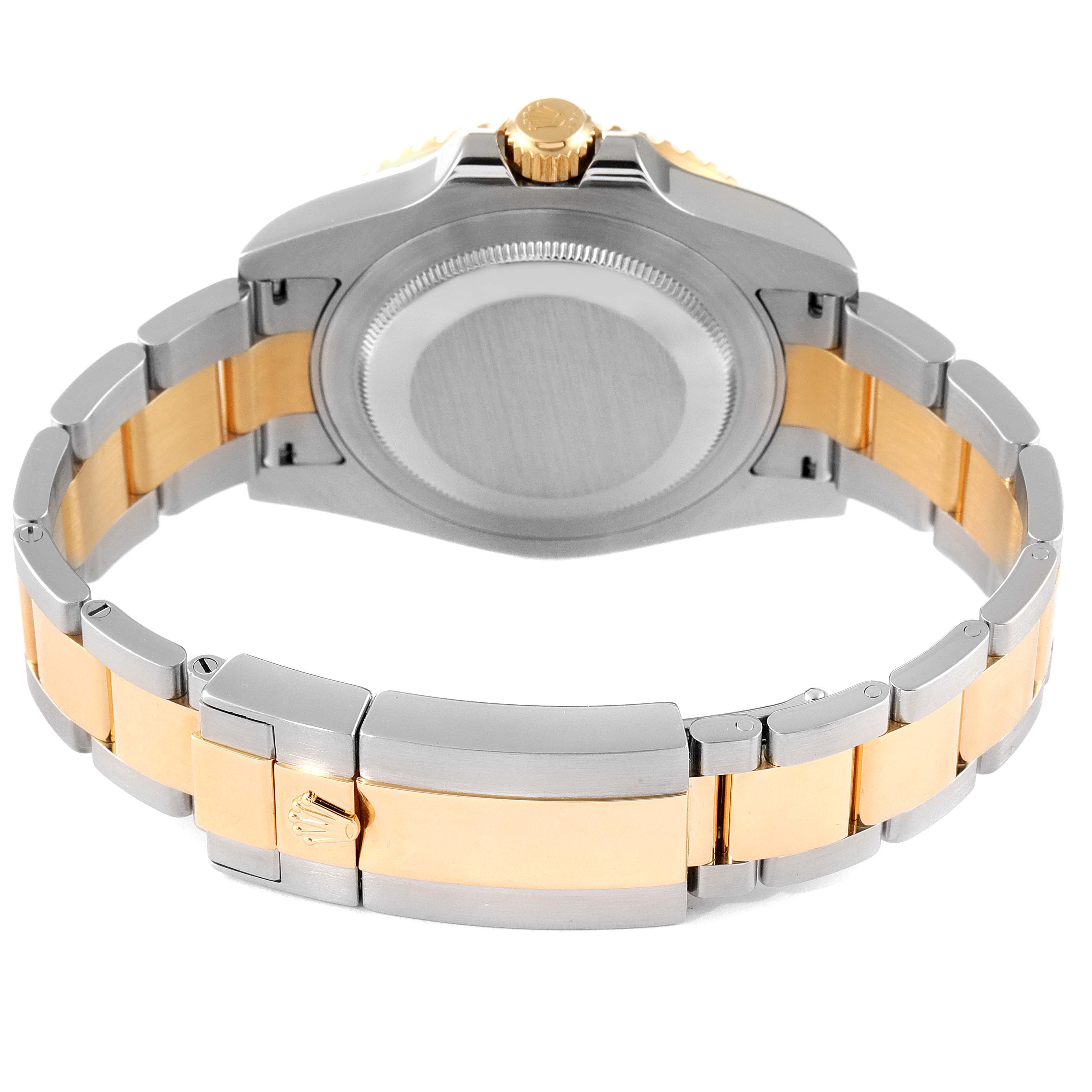 The image shows the back case and bracelet of a Rolex GMT-Master 116713 Men's Steel and Gold (two tone) Black Dial 116713 Men's Steel and Gold (two tone) Black Dial watch, focusing on the clasp and case back.