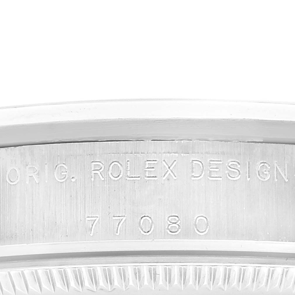 This image shows a close-up of the model number and "ORIG. ROLEX DESIGN" engraving on the case of a Mid-Size Rolex watch.