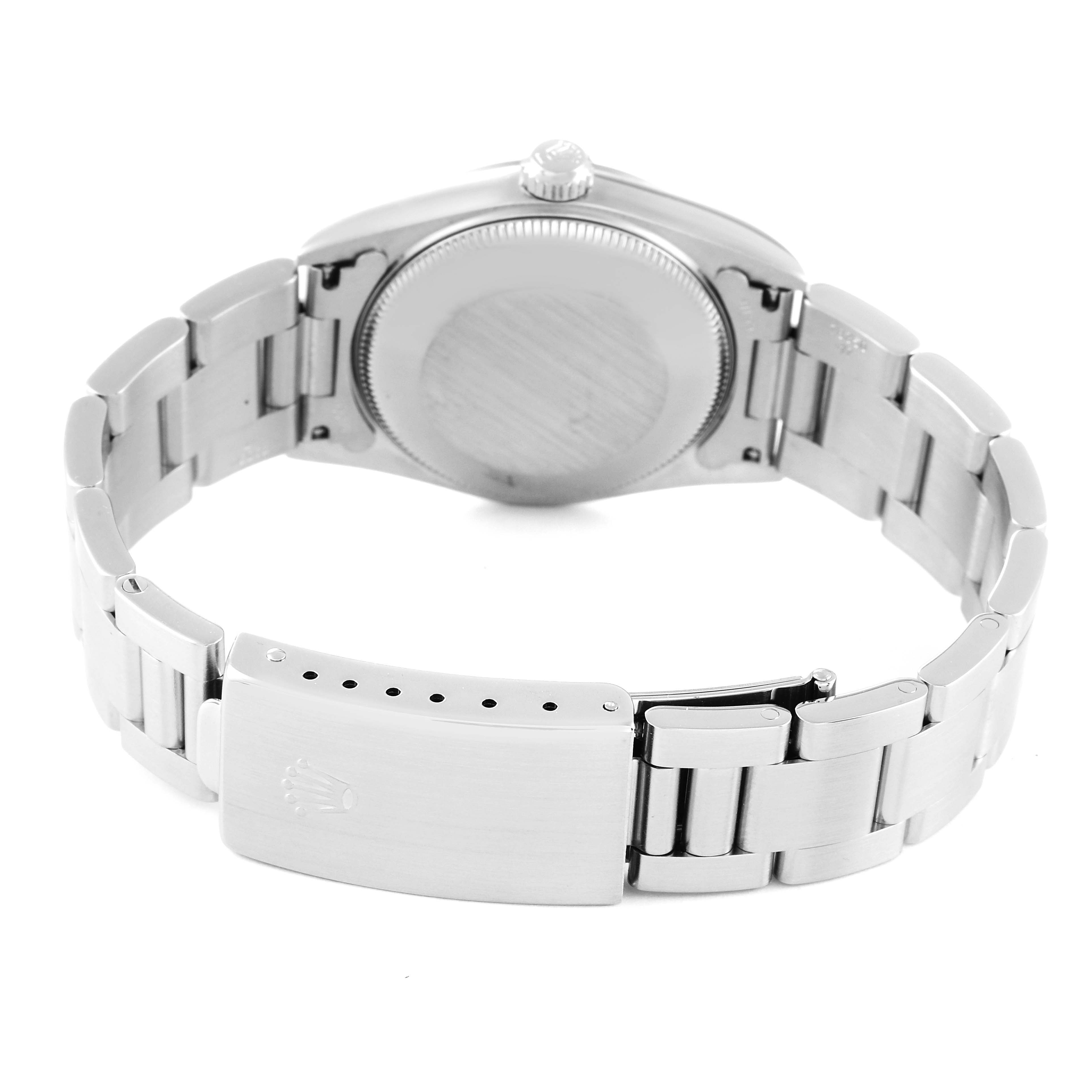 The image shows the back view of the Rolex Mid-Size 77080 Women
s Stainless Steel Pink Dial 77080 Women
s Stainless Steel Pink Dial model watch, focusing on the clasp, bracelet, and case back.