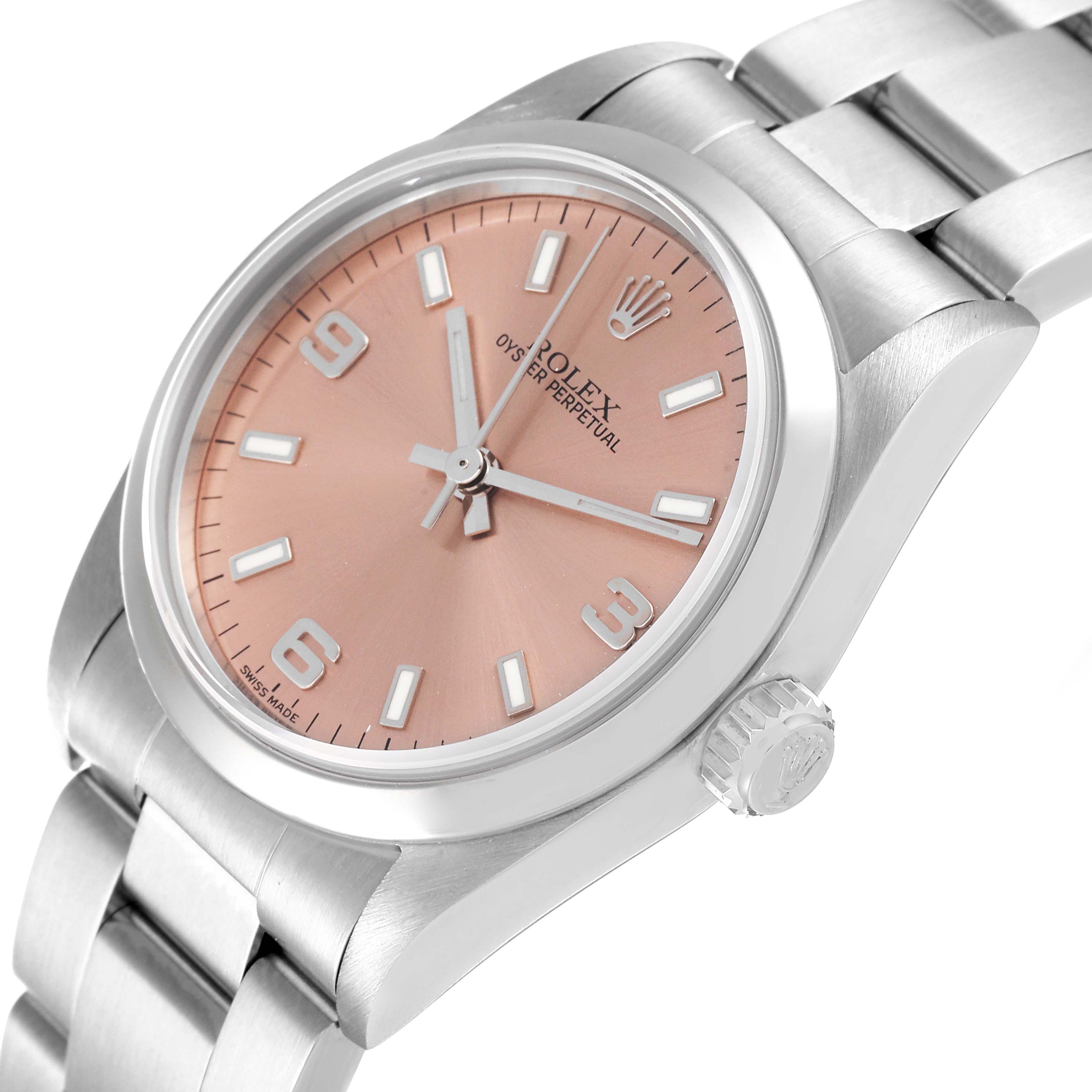 This image shows a close-up and angled view of the Rolex Mid-Size 77080 Women
s Stainless Steel Pink Dial 77080 Women
s Stainless Steel Pink Dial Oyster Perpetual watch, highlighting the crown, case, bracelet, and dial.