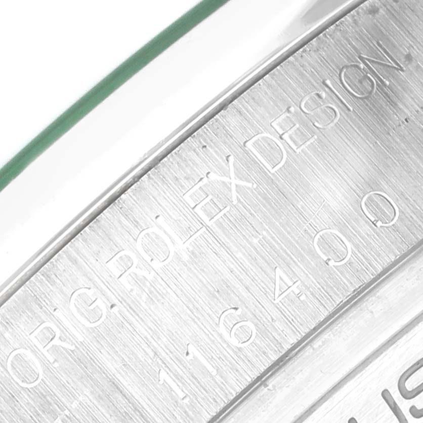 This close-up image shows the serial number and engraved text on the side of a Rolex Milgauss 116400GV Men's Stainless Steel Blue Dial 116400GV Men's Stainless Steel Blue Dial watch case.