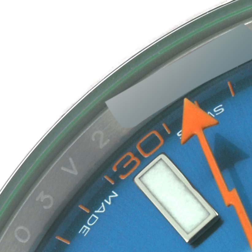 The image shows a close-up of the dial and orange second hand of a Rolex Milgauss 116400GV Men's Stainless Steel Blue Dial 116400GV Men's Stainless Steel Blue Dial watch.
