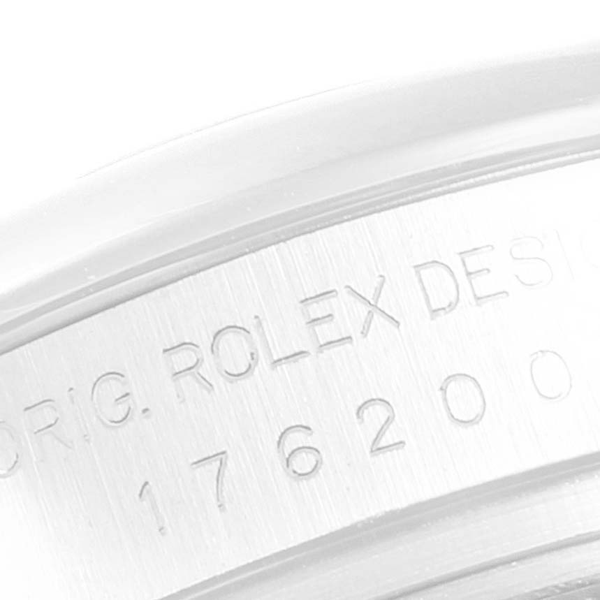 This close-up image shows the side engraving on the case of a Rolex Oyster Perpetual 176200 Women's Stainless Steel Pink Dial 176200 Women's Stainless Steel Pink Dial watch.
