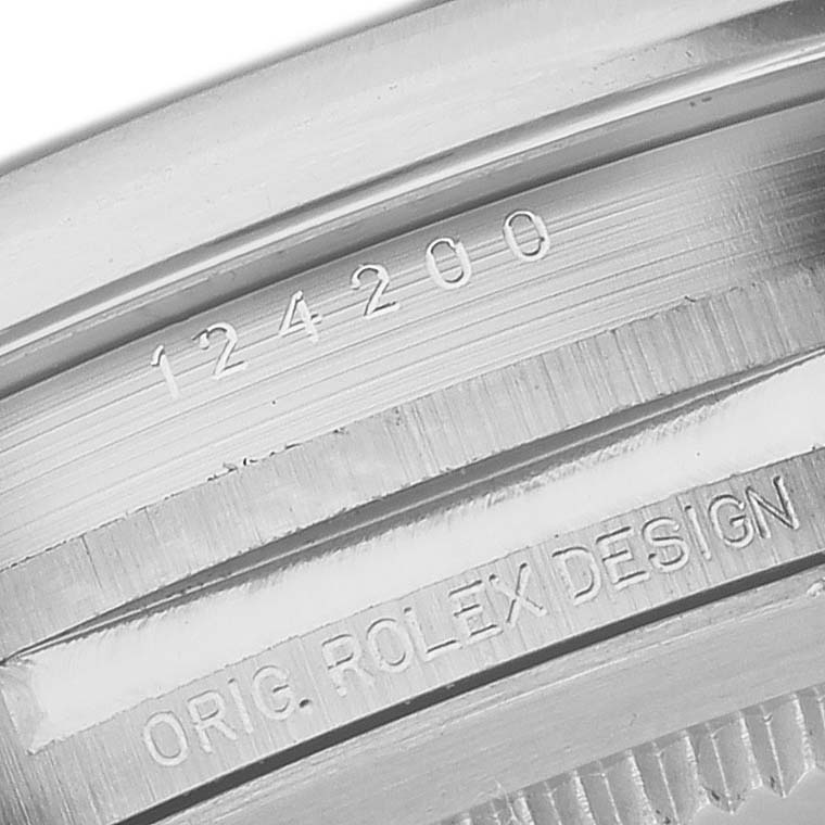 The image displays the inner bezel of a Rolex Oyster Perpetual 124200 Men's Stainless Steel Silver Dial 124200 Men's Stainless Steel Silver Dial watch with engravings, including the model number 124200 and "Orig. Rolex Design."