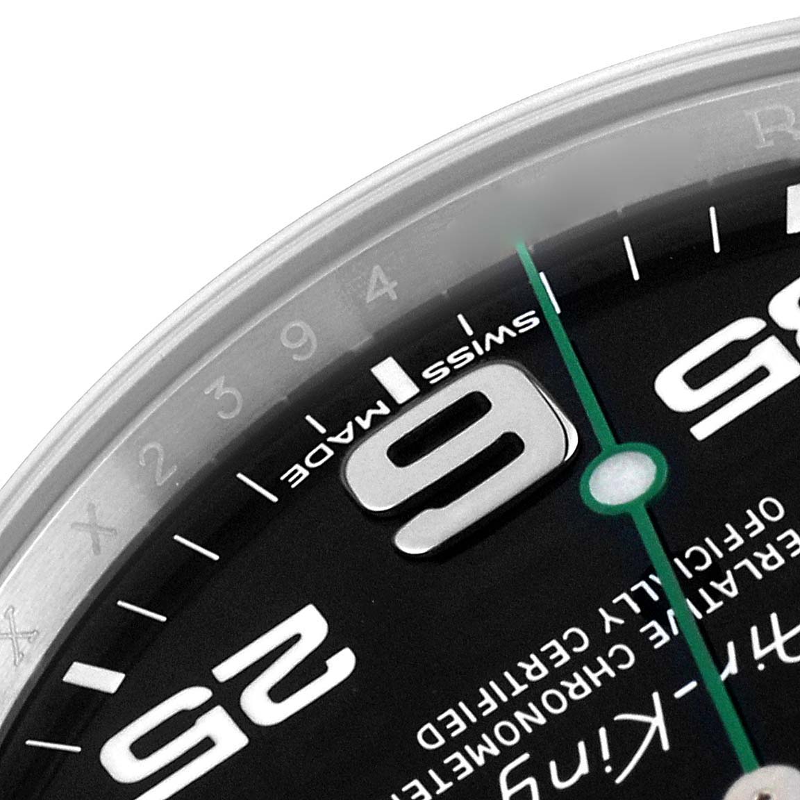 Close-up of the Rolex Air-King 116900 Men's Stainless Steel Black Dial 116900 Men's Stainless Steel Black Dial watch face, showing part of the dial with the 9 and 25 numerals and the Swiss Made label.