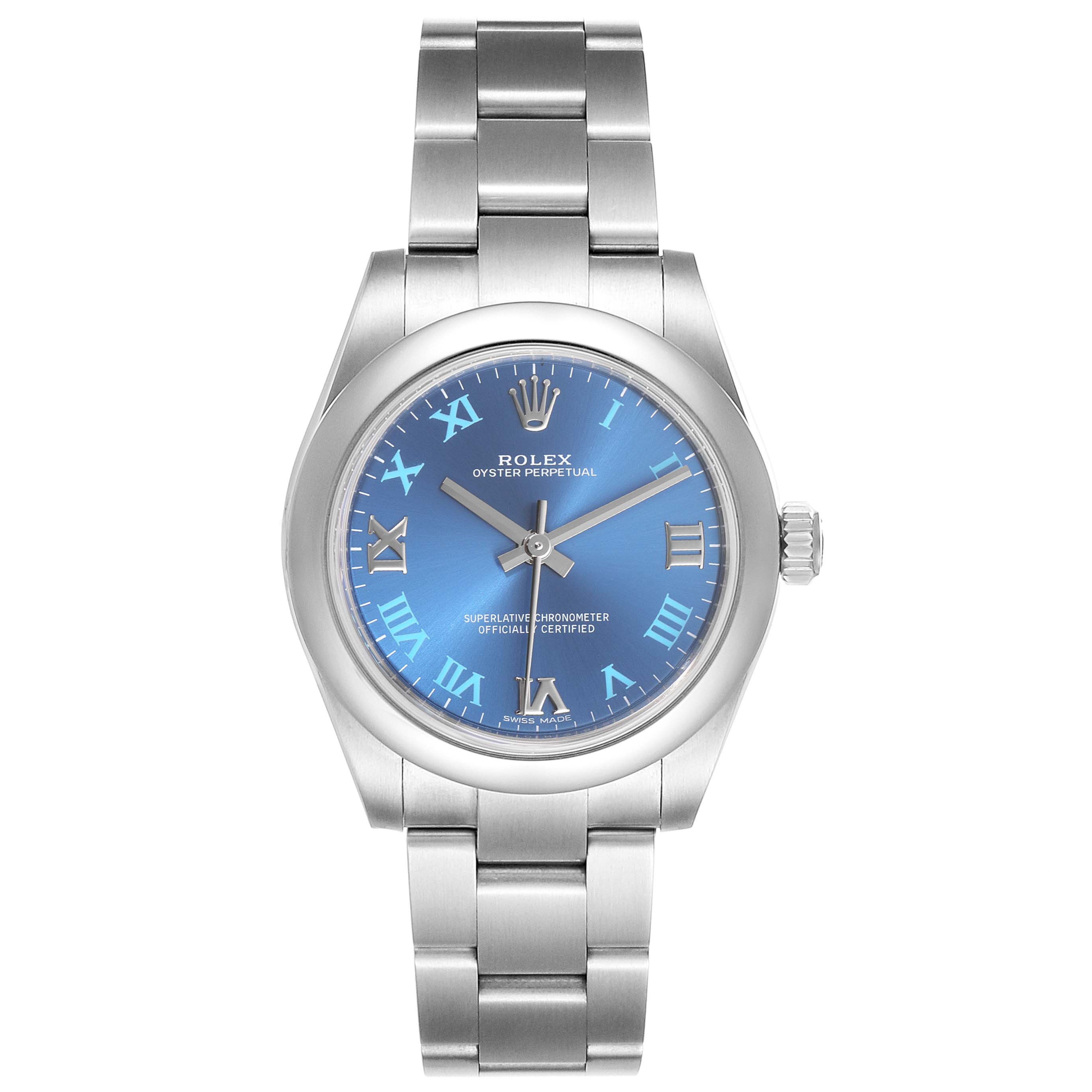The image shows a front view of a Rolex Oyster Perpetual Mid-Size watch with a blue dial and stainless steel bracelet.