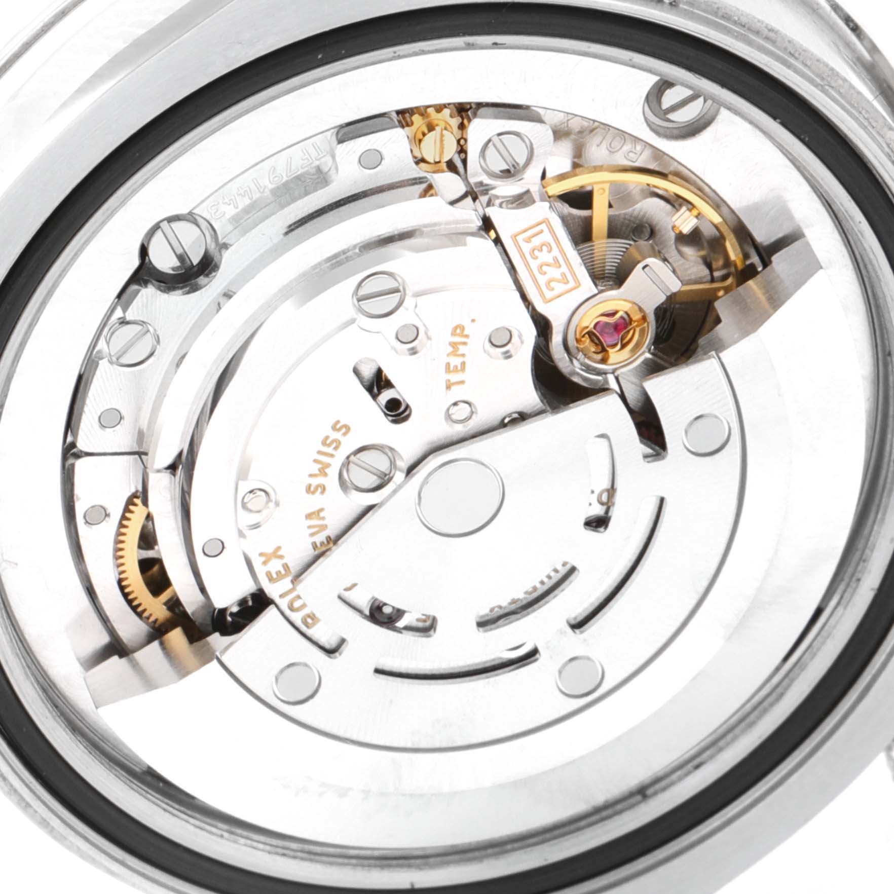 This image shows the internal mechanism of a mid-size Rolex watch, viewed from the back.